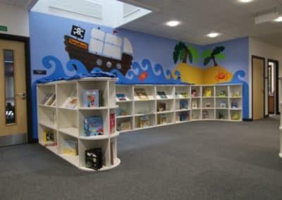 BrookhouseUK - Hamadryad Primary School Library with boat cartoon on wall