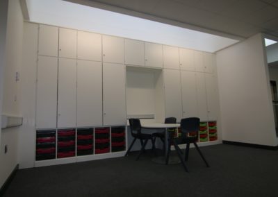 BrookhouseUK - Storage wall with desks for Hamadryad